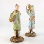 A pair of Royal Worcester shot enamel figures, water carriers