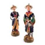 A pair of Dudson, Staffordshire porcelain figures of Oriental man and Woman