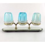 A set of three blue opaline fairy lamps