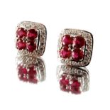 A pair of 18ct gold ruby and diamond cluster earrings