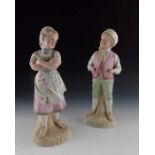 A pair of Gebruder Heubach bisque figures of children