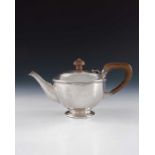A E Jones, an Arts and Crafts silver teapot, Birmingham 1922