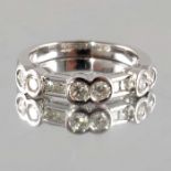 An 18ct gold vari-cut diamond half eternity ring