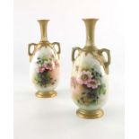 G H Cole for Royal Worcester, a pair of twin handled vases