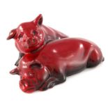 Charles Noke for Royal Doulton, a Flambe Pig figure group