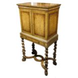 A Louis XIV style figured and crossbanded walnut drinks chest on stand