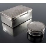 A George V silver cigarette box and jewellery casket