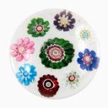Clichy, spaced millefiori paperweight, containing nine individual canes, clear ground, circa 1850, p