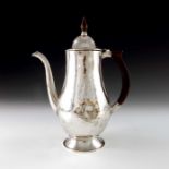 An Arts and Crafts silvered copper coffee pot