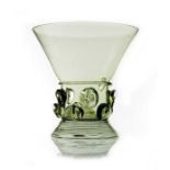 An Arts and Crafts style Dutch Revivalist green glass goblet, in the style of Harry Powell