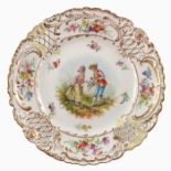 A Dresden cabinet plate, painted with pastoral courting figures
