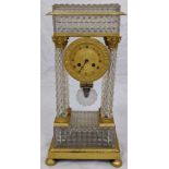 A French Empire Portico clock,four crystal column supports mounted with ormolu Corinthians with