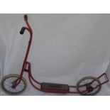 A red Triang scooter