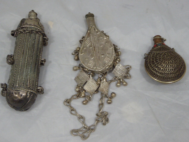 Three Silver Pendants in the shape of Amulet Box and Snuff Bottle, Oman, 19th century, together with