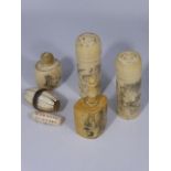 Four Japanese bone containers carved with figural scenes, together with two beads with character