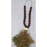 19th century Chinese rhinoceros horn prayer beads, mounted with a carved ivory rabbit and tassel, 25