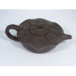 A Chinese yixing clay teapot with frog handle, character marks to base, L.15cm