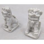 A pair of 18th century Chinese blanc de chine brush holders in the form of dogs of fo H.9cm