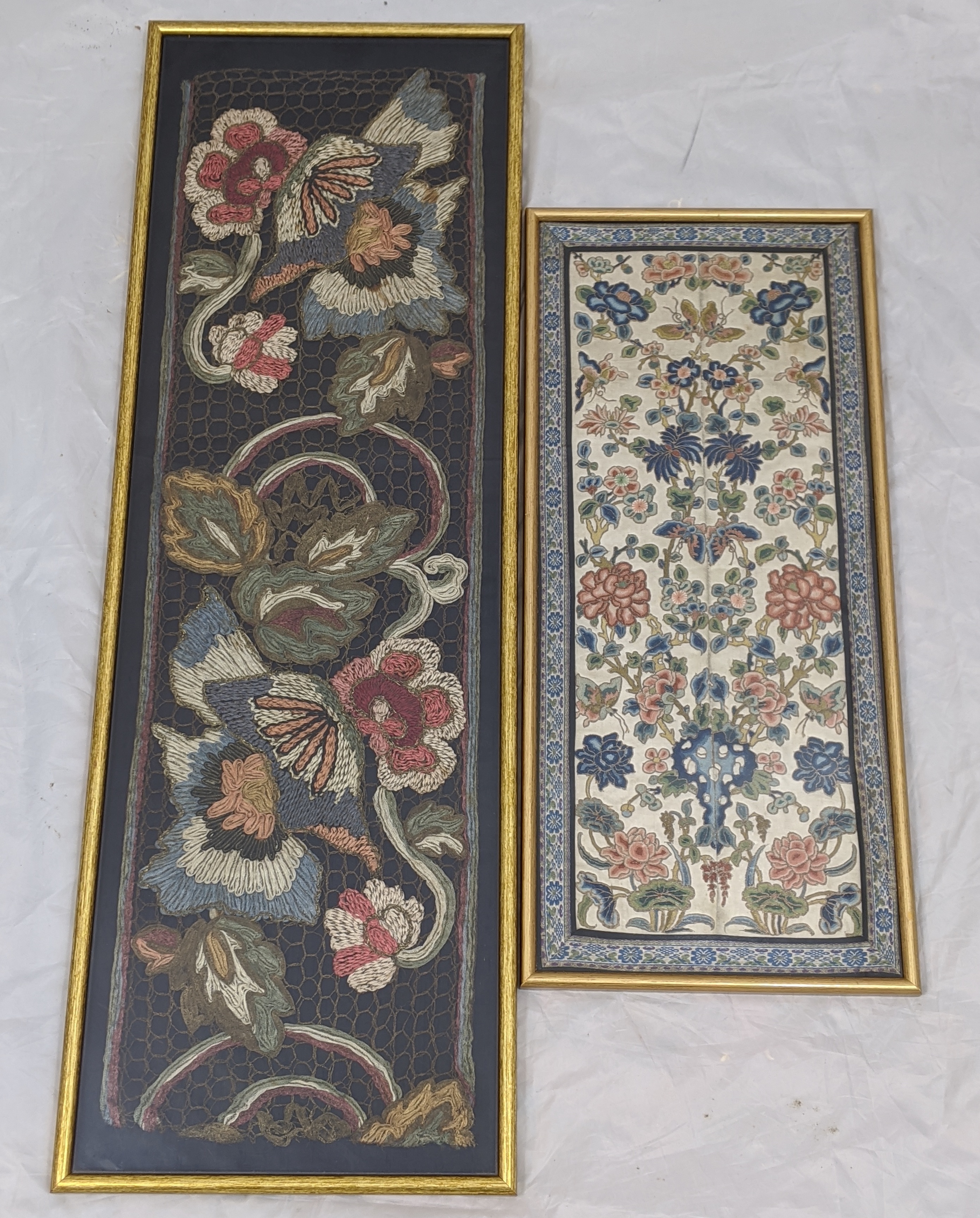 An 18th century Chinese embroidery depicting flora and fauna, together with one other embroidery