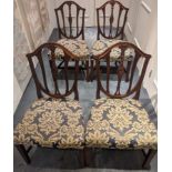 Four mahogany framed dining chairs with floral upholstery