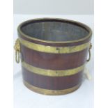 19th century mahogany peat bucket, brass bound with twin hoop handles with lion head mounts and