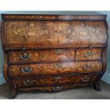 An 18th century Dutch walnut marquetry bombe bureau, inlaid with urns, flora and fauna, the roll top