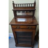 An Arts & Crafts mahogany cabinet, single drawer over glass door, upper shelf with integrated