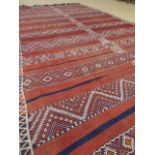 Red ground Afghan rug