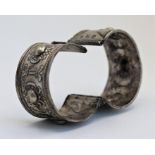 A pair of Middle Eastern silver cuffs, bearing marks, H.4cm W.12cm