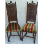 Pair of Gothic style carved oak hall chairs, H.116cm