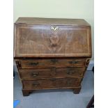 A 19th century walnut bureau, compartmentalised interior over two long drawers, H.93cm W.77cm