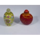 Two 19th century Chinese scent bottles, jadeite and coral stoppers. Provenance: Purchased by the