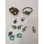 A collection of Middle Eastern Jewellery, to include bangles, earrings, and rings, mounted with