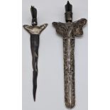 Two Eastern daggers, one with silver blade and filigree silver scabbard, hallmarked, the other