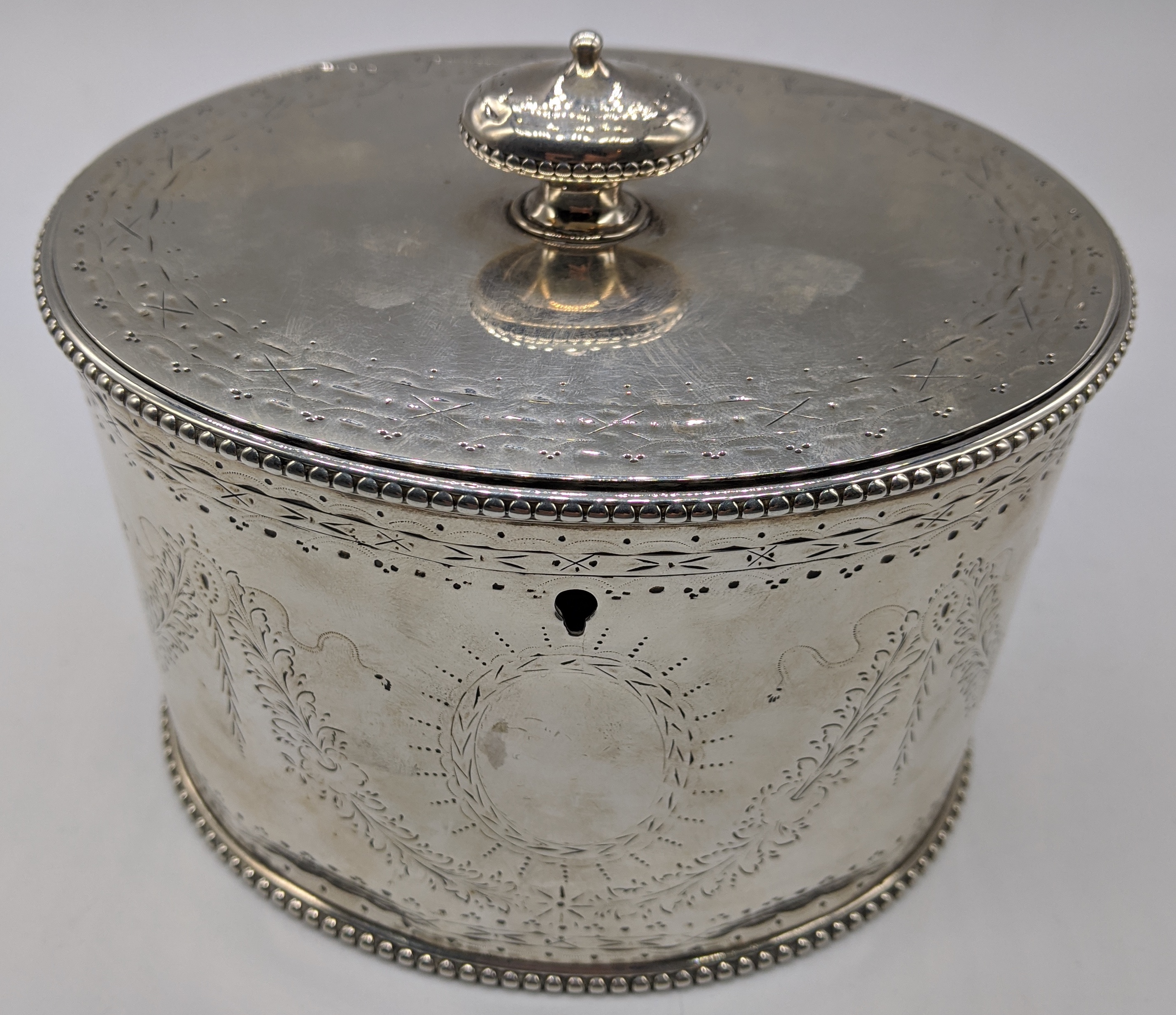 A Victorian silver tea caddy,vacant cartouche, hallmarked London 1866, maker Robert Harper, 548g,