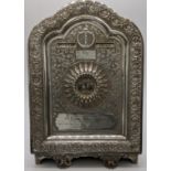 An Indian silver desk calendar, month, day and date rotating aperture, the lower cartouche