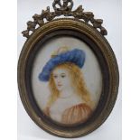 A 19th century miniature portrait of a maiden, oil, indistinctly signed, H.7.5cm