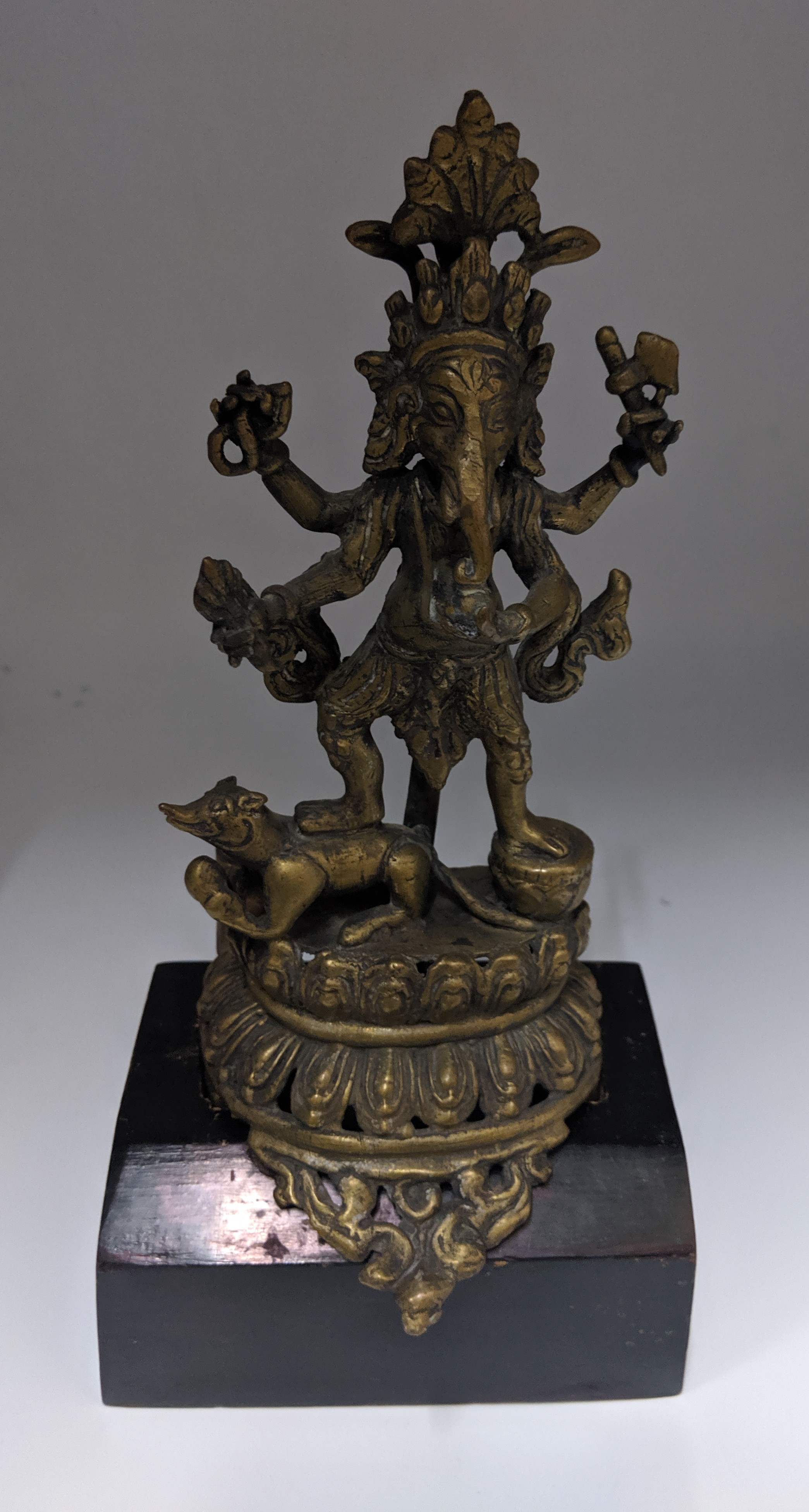 Cast Brass Image of Ganesh & his Vahana, Nepal, 19th century, height without stand: 20.5cm, height