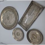 Four Indian silver trays, largest diameter 20.5cm, rectangular tray (hallmarked) L.19.5cm, two