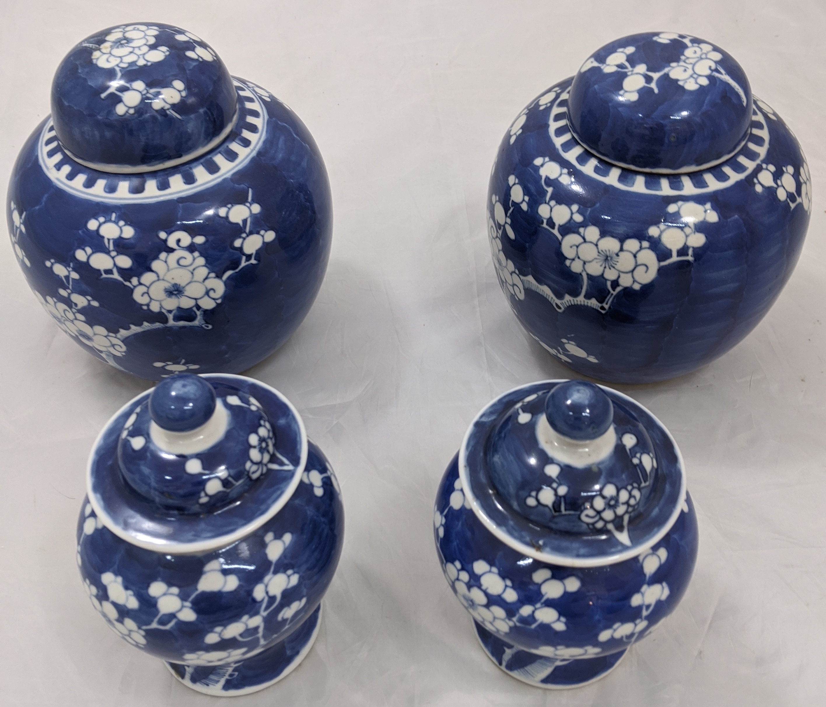 Four Chinese blue and white ginger jars, double circle and character marks to bases, H.19cm (