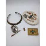 A group of miscellaneous items to include a torque necklace, silver candlestick and pencil and a