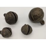 Four 19th century cast iron buffalo bells, Tibetan or Burmese