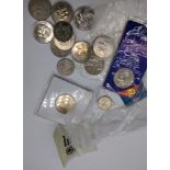 A collection of coins, mostly commemorative