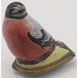 A George III Bilston enamel patch box in the form of a bird, the hinged cover decorated with a spray