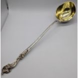 A large German silver punch ladle, mark for Augsburg City, Bavaria, gilt interior, stylised