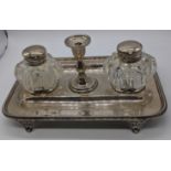 A Victorian silver ink stand, hallmarks to tray, silver collars of glass containers and central