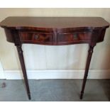 An early 20th century mahogany console table, serpentine front, twin drawers