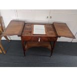 A Hepplewhite 18th century mahogany and rosewood dressing table, the upper flaps unfold to reveal