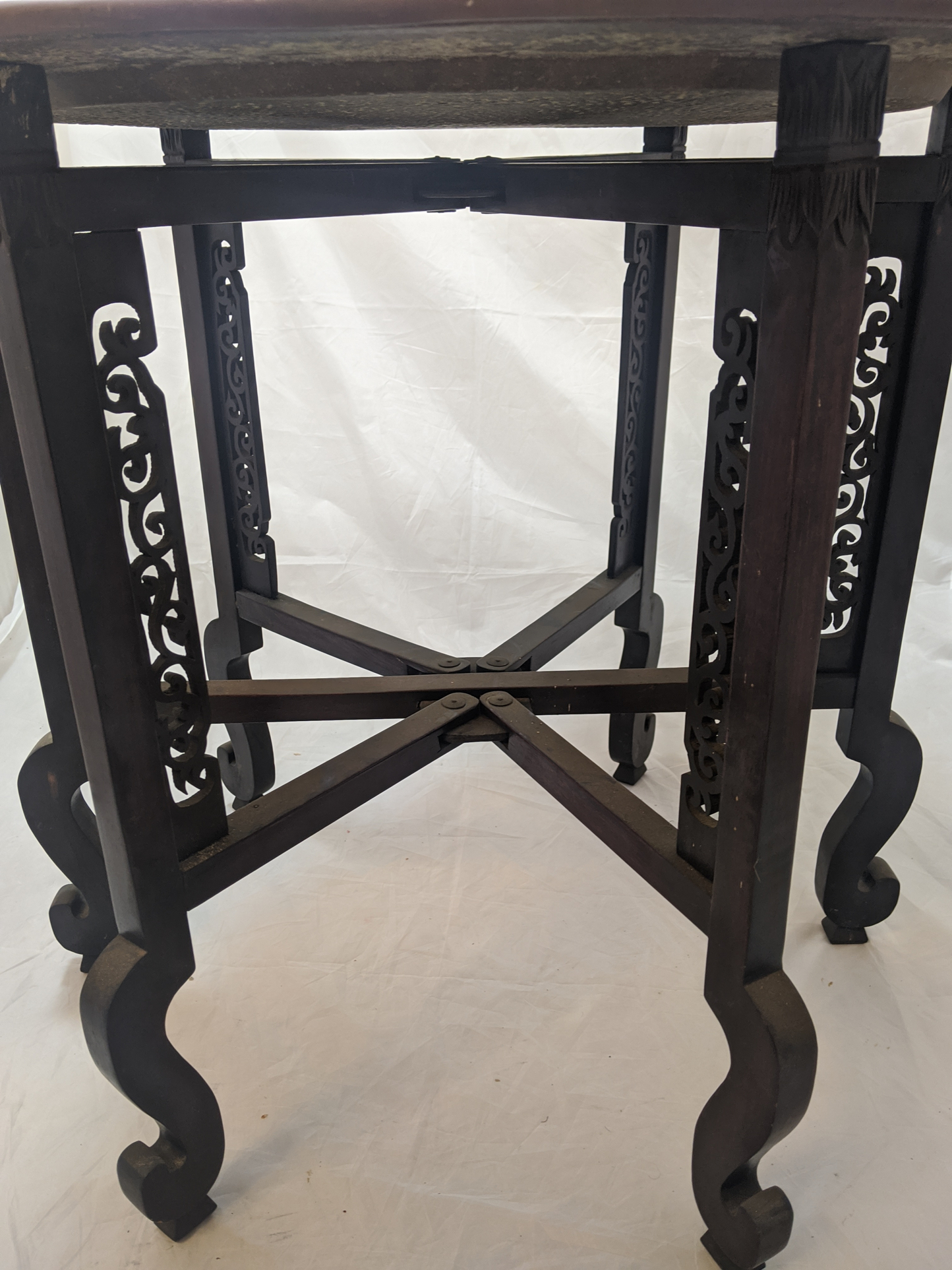 A Chinese folding tables with circular copper top, carved and pierced legs - Image 3 of 3