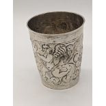 An 18th century German silver beaker, repousse embossed, marks for Frankfurt, 66g, H.8.5cm